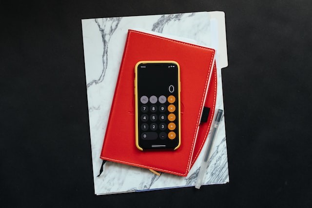 iPhone calculator on top of notebooks iPhone calculator on top of notebooks